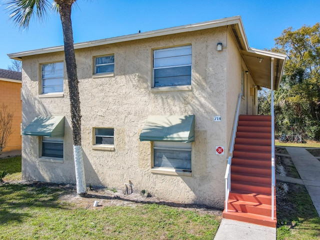 exterior space featuring stucco siding