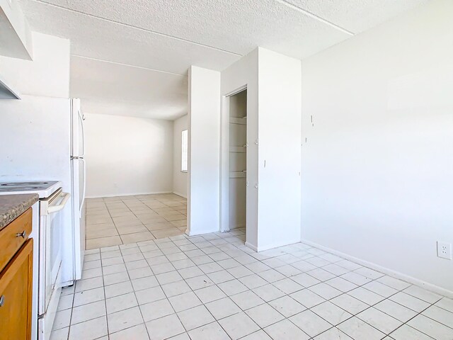 Xx Michigan Court, Saint Cloud, FL 34769 - kitchen with visible vents, brown cabinets, a sink, under cabinet range hood, and white appliances