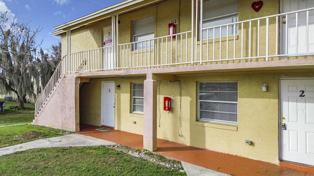 exterior space featuring stucco siding