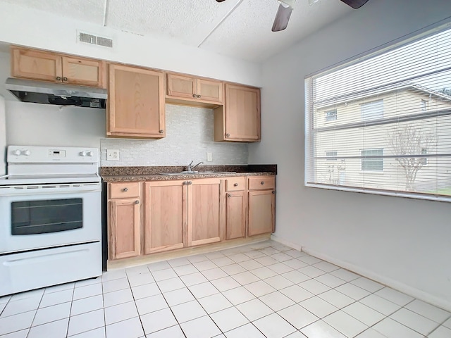 kitchen with white electric range oven, visible vents, a sink, under cabinet range hood, and dark countertops