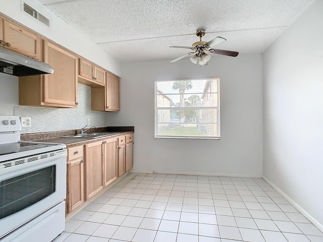 kitchen featuring visible vents, light brown cabinets, a sink, under cabinet range hood, and white electric range oven