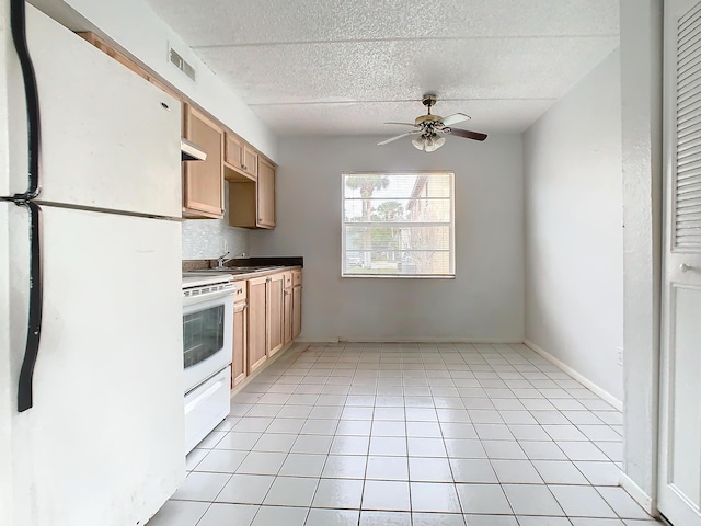 kitchen featuring visible vents, a textured ceiling, white appliances, light tile patterned floors, and ceiling fan