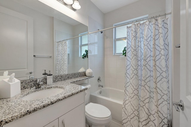 full bathroom featuring shower / tub combo, vanity, and toilet