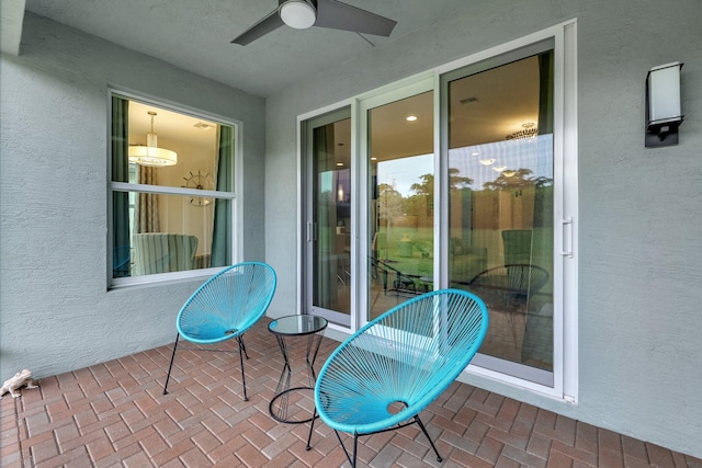 view of patio featuring ceiling fan