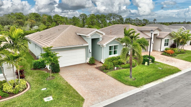 ranch-style house with a front yard and a garage