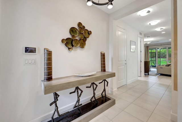 hallway with light tile patterned flooring