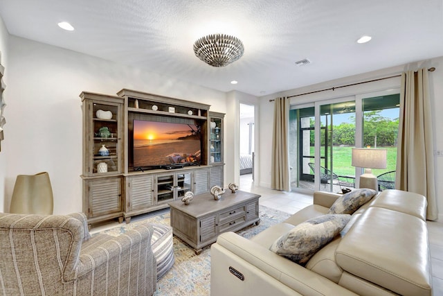 tiled living room with a textured ceiling