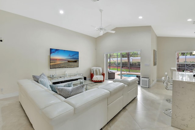 living room with high vaulted ceiling and ceiling fan