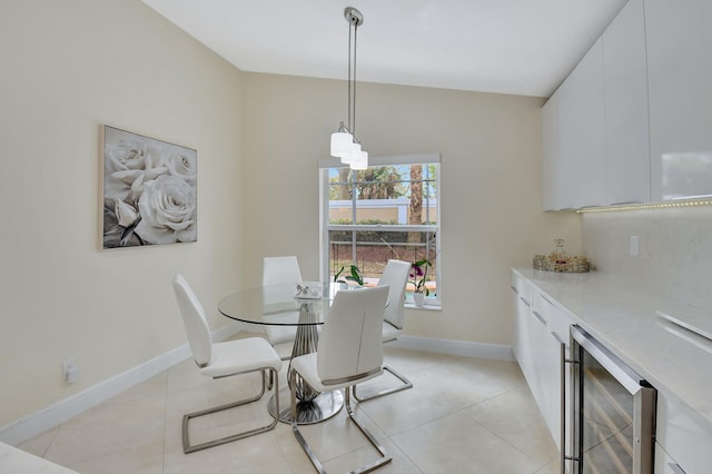 tiled dining room featuring wine cooler and indoor bar