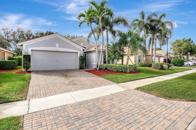 single story home with a front lawn and a garage