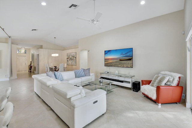 living room with ceiling fan and vaulted ceiling