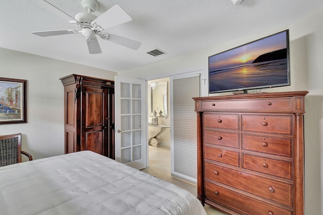 bedroom featuring ensuite bath and ceiling fan