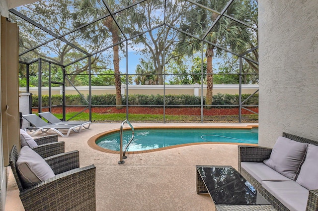 view of pool with a lanai, an outdoor hangout area, and a patio