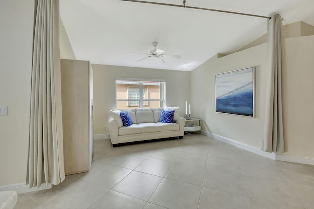 unfurnished living room with ceiling fan, lofted ceiling, and light tile patterned floors