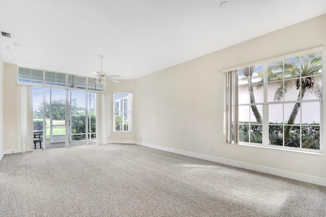 unfurnished room featuring carpet flooring and ceiling fan