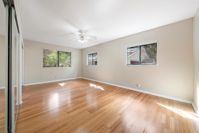 unfurnished bedroom with ceiling fan and light hardwood / wood-style floors