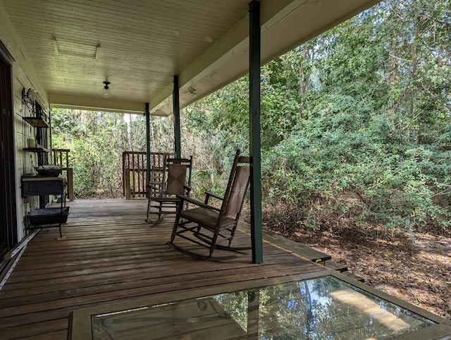 wooden deck featuring covered porch