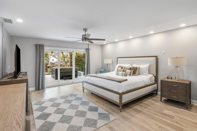 bedroom featuring ceiling fan, light hardwood / wood-style flooring, and access to exterior