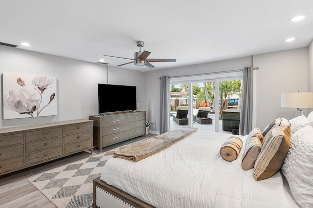 bedroom featuring ceiling fan, light hardwood / wood-style floors, and access to exterior