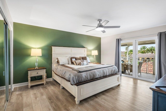 bedroom with french doors, access to exterior, ceiling fan, and light wood-type flooring