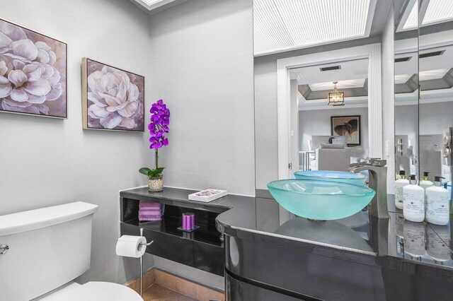 bathroom featuring tile patterned flooring, walk in shower, and vanity