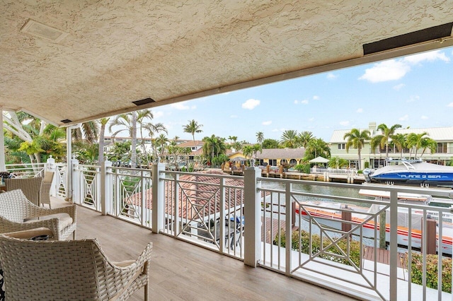 balcony featuring a water view