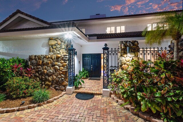 mediterranean / spanish house featuring a garage