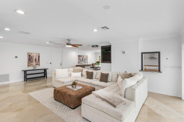 living room with ceiling fan and ornamental molding