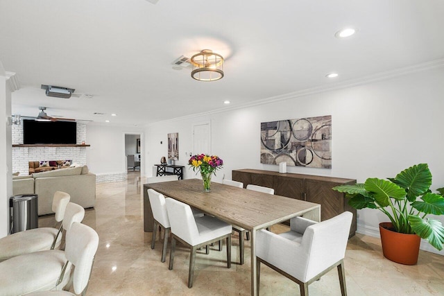 dining space with crown molding