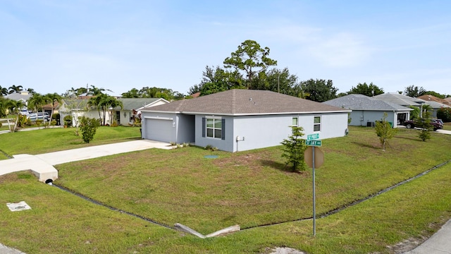 ranch-style home with a front yard and a garage