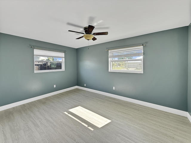 spare room with ceiling fan and light hardwood / wood-style floors