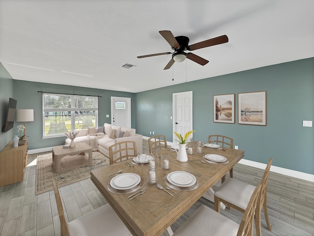 dining room featuring ceiling fan