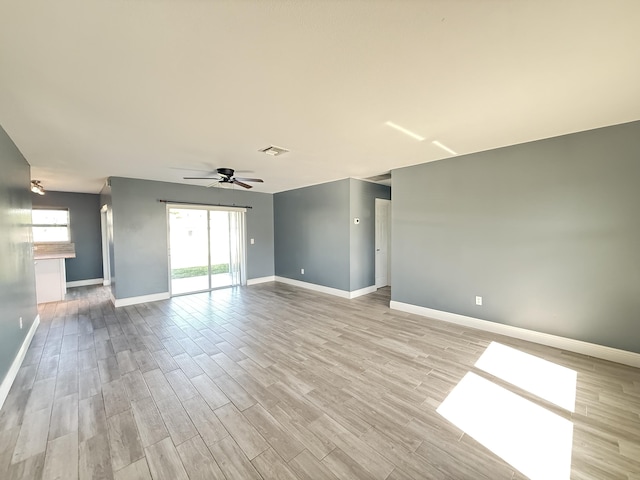 unfurnished room with ceiling fan and light hardwood / wood-style flooring