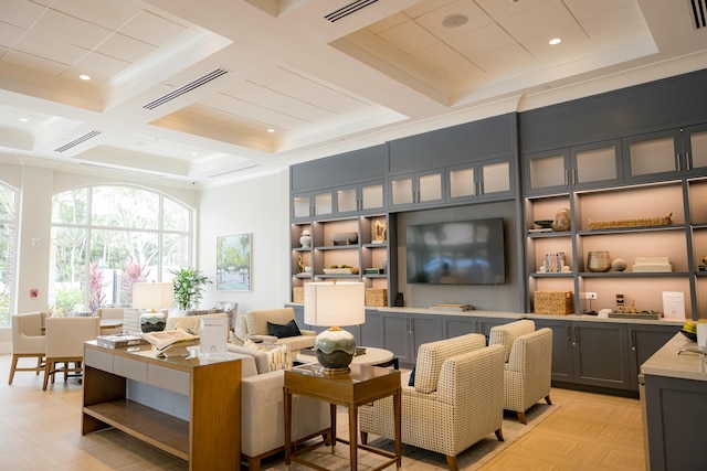 living room with ornamental molding, beam ceiling, and coffered ceiling