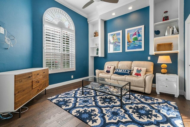 living room with ceiling fan, dark hardwood / wood-style flooring, built in features, and ornamental molding