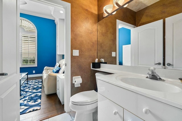 bathroom featuring toilet and vanity