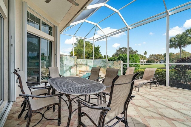 sunroom / solarium featuring vaulted ceiling