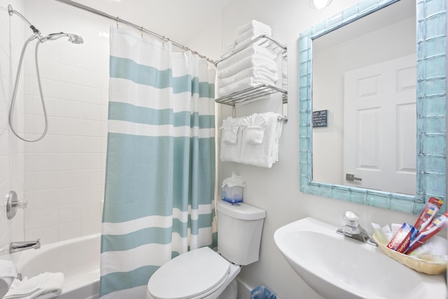 full bathroom with toilet, shower / bath combination with curtain, and sink