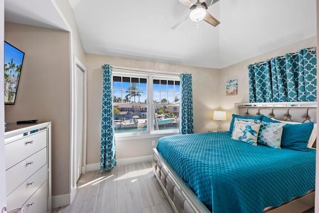 bedroom with ceiling fan and light hardwood / wood-style flooring