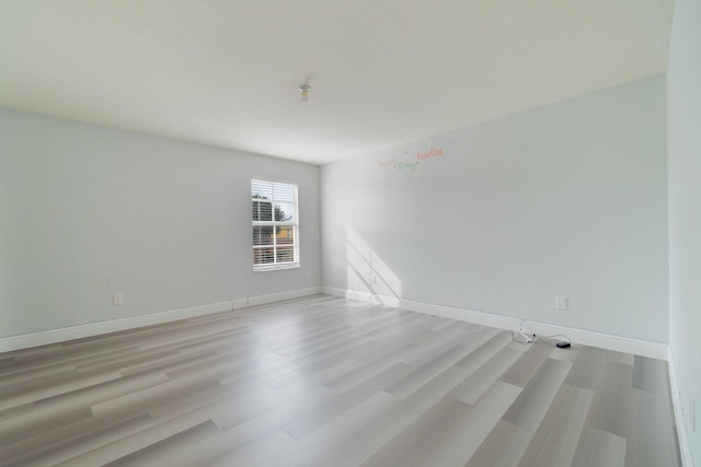 unfurnished room featuring light hardwood / wood-style floors