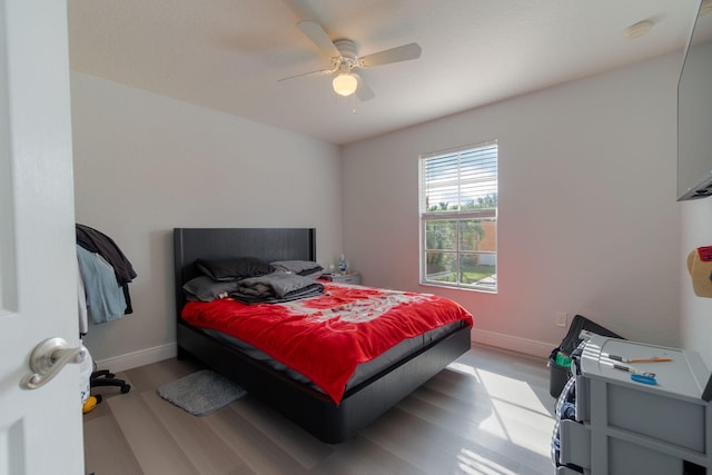 bedroom featuring ceiling fan and light hardwood / wood-style flooring