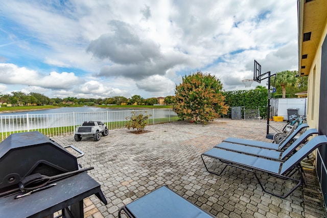 view of patio / terrace featuring a water view