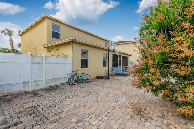 back of property featuring a patio area