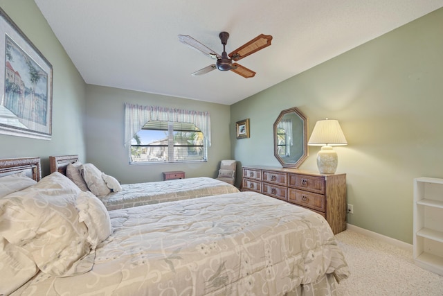 bedroom with ceiling fan and light colored carpet