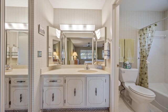 full bathroom with toilet, shower / bathtub combination with curtain, and vanity