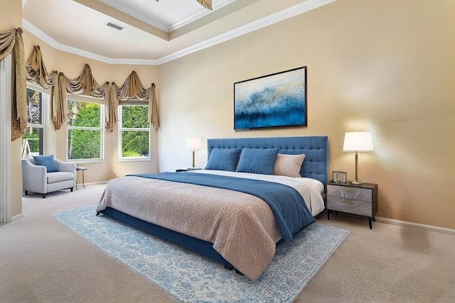 bedroom with ornamental molding and carpet flooring