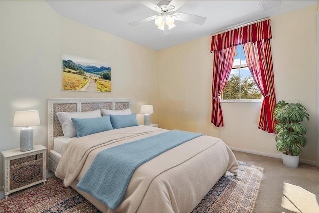 bedroom with ceiling fan and carpet