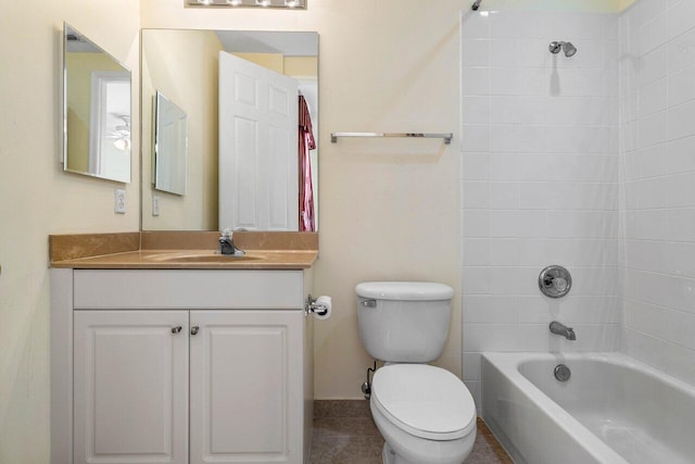 full bathroom with tile patterned floors, toilet, vanity, and tiled shower / bath