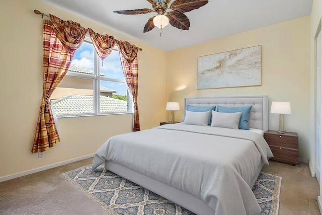 bedroom with light colored carpet and ceiling fan