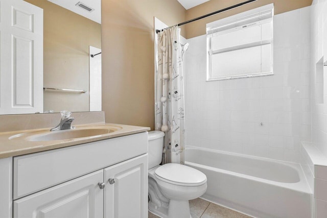 full bathroom with vanity, shower / bath combination with curtain, tile patterned floors, and toilet